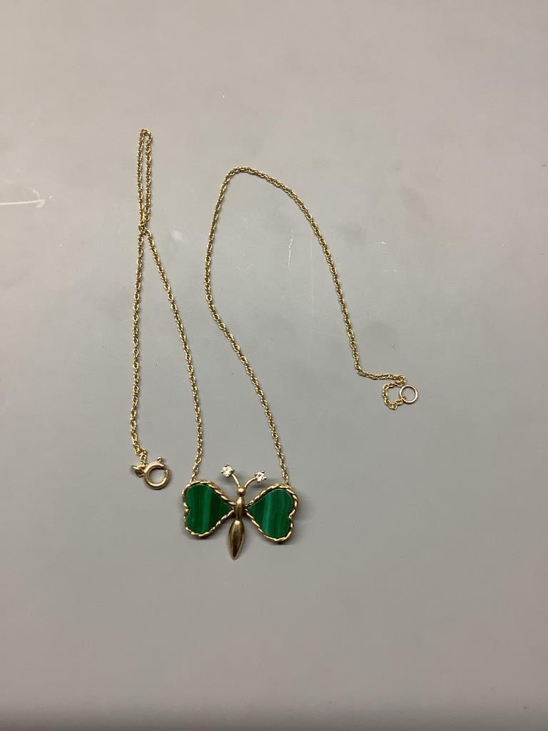 A modern 9ct gold malachite and diamond set butterfly pendant necklace, pendant width 29mm, gross weight 6.1 grams.